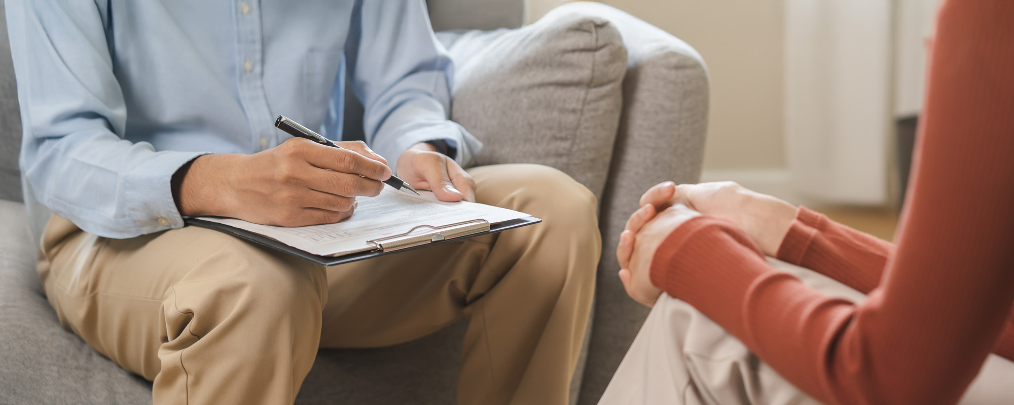 Sad asian young woman consultation with psychologist